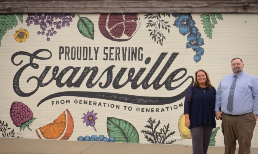 proudly serving Evansville murals with Paul's Pharmacy employees